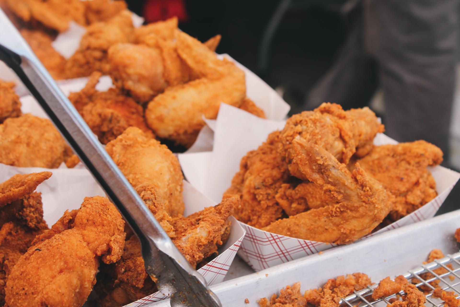 Trays of fried chicken wings ready to serve